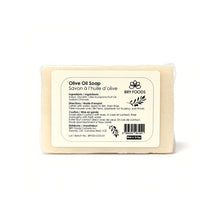 Bar of olive oil soap with a label on a white background